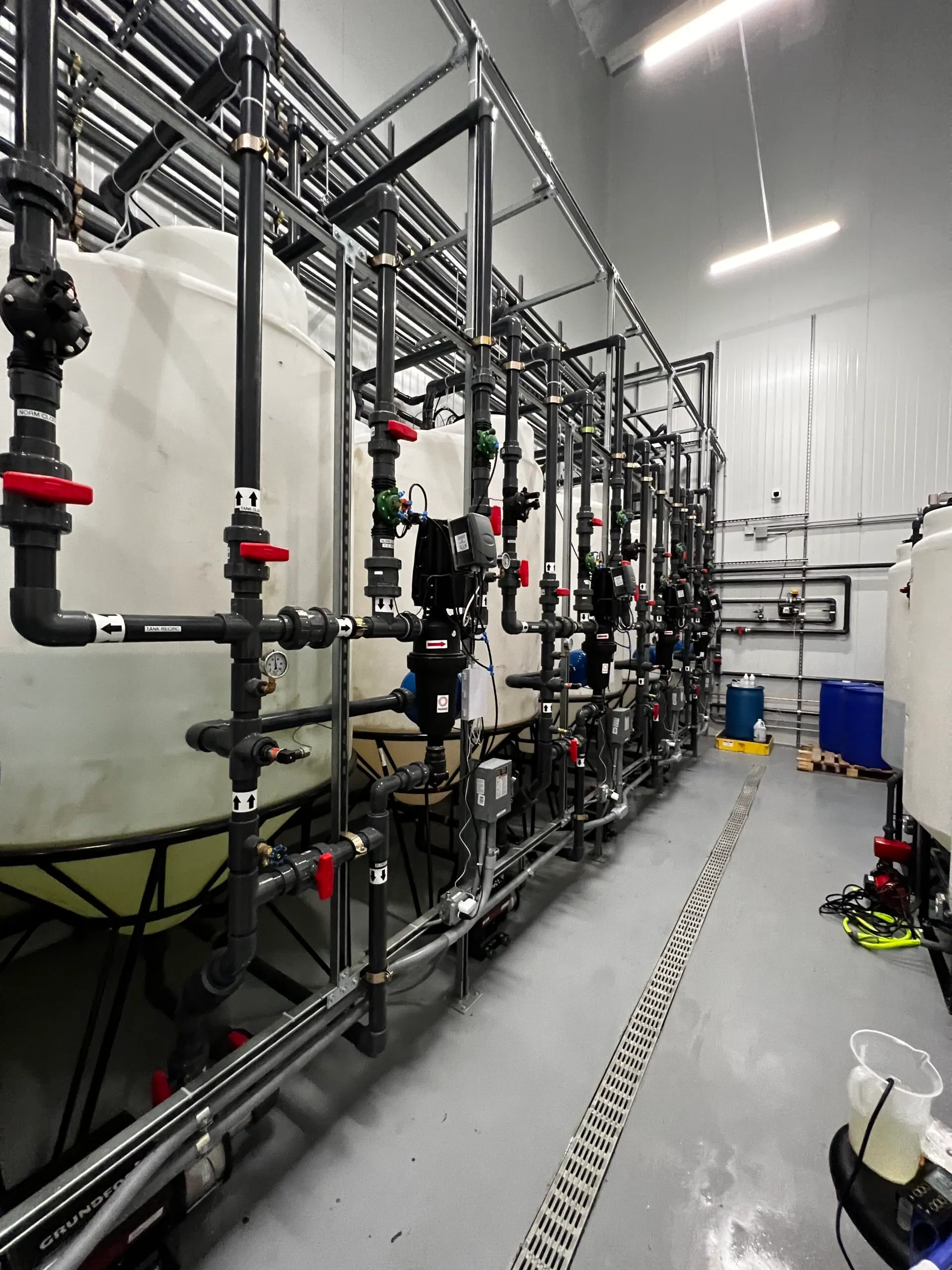 Water room with process piping on a steel frame.
