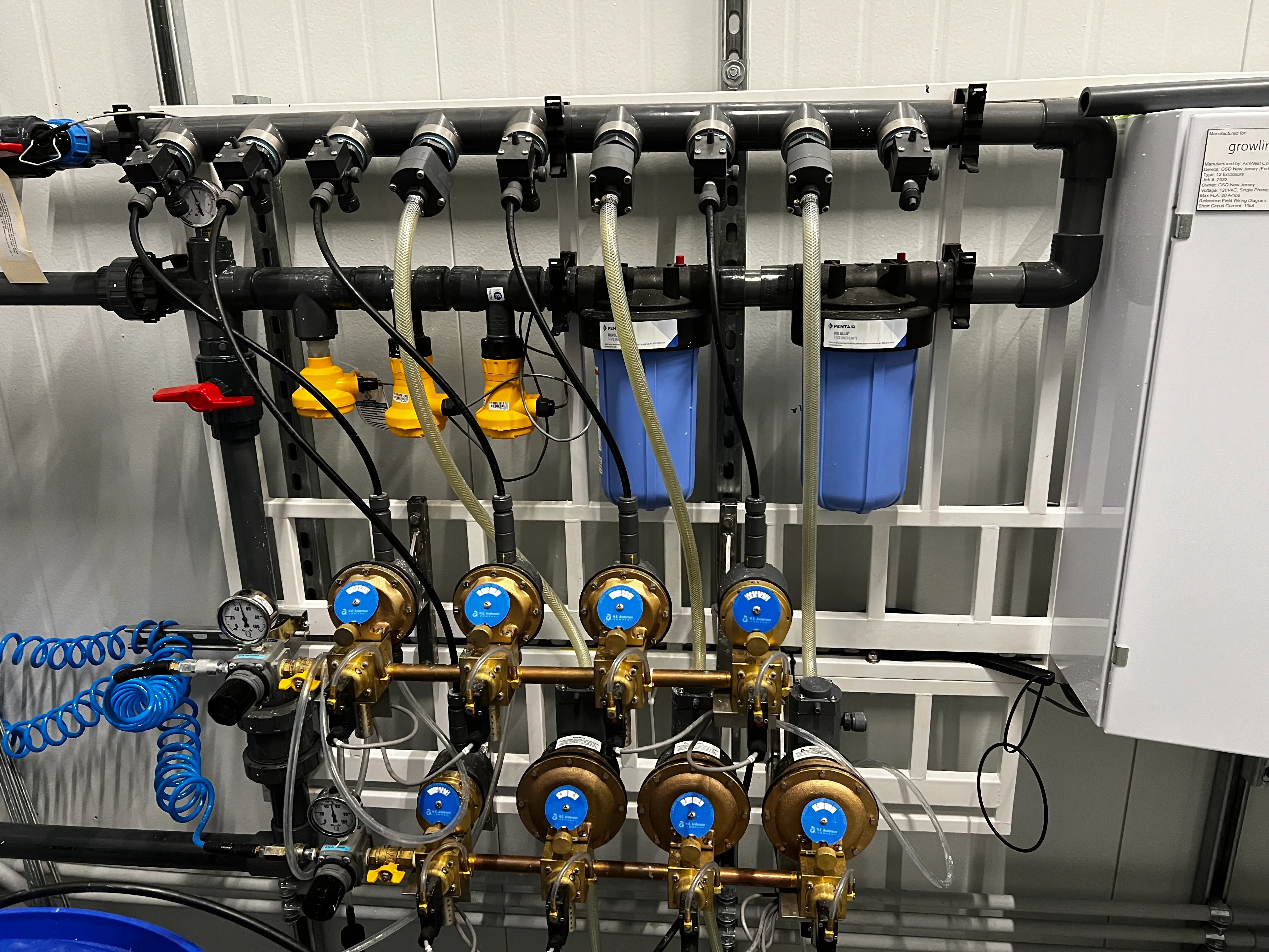 Fertigation skid with dosing valves, filters and controller.